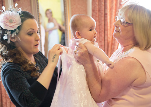 bride and mother of the bride dressing baby daughter wortley hall hotel sheffield