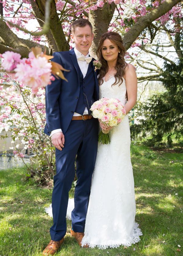 bride and groom under cherry blosson tree the stables high melton doncaster
