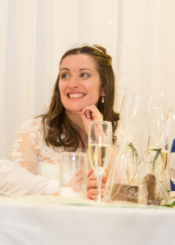 bride smiling against sparkle backdrop holiday inn barnsley