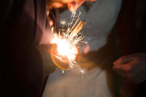 close up lighting a sparkler bonfire night wedding holiday inn barnsley photographer