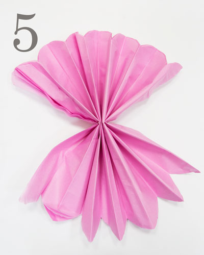 Paper Pom-poms partially made folded and opened out