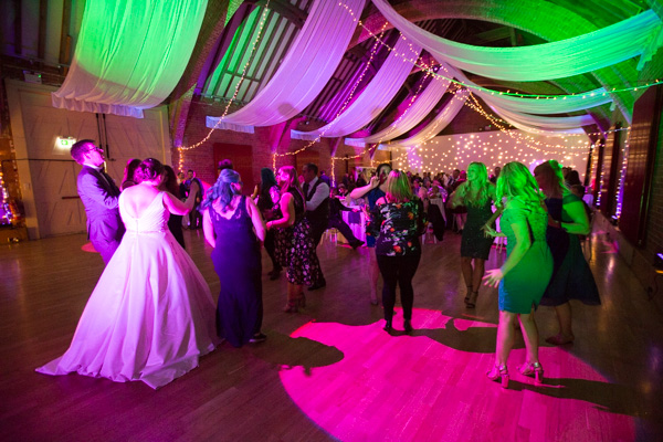 Guests dancing during the wedding reception at Thoresby Courtyard