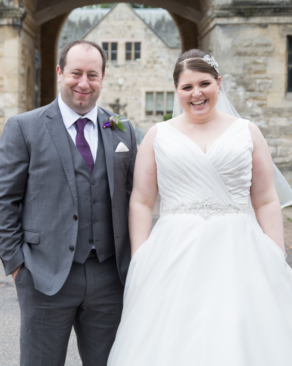 Bride and Groom with their hands in their pockets at Thoresby Courtyard wedding