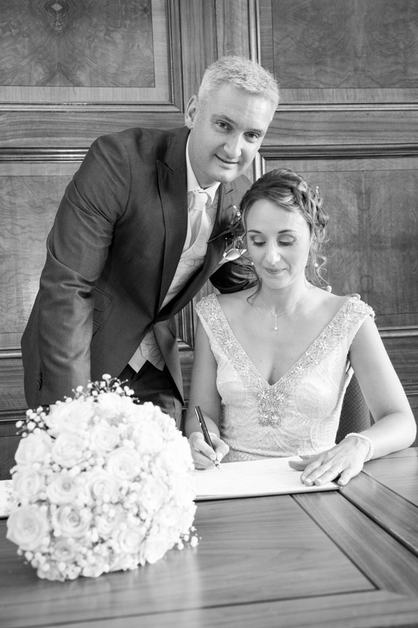 Bride and Groom signing the register at Barnsley Town Hall
