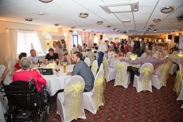 The griffin suite set up for a wedding and full of guests at Shaw Lane Sports Club Wedding
