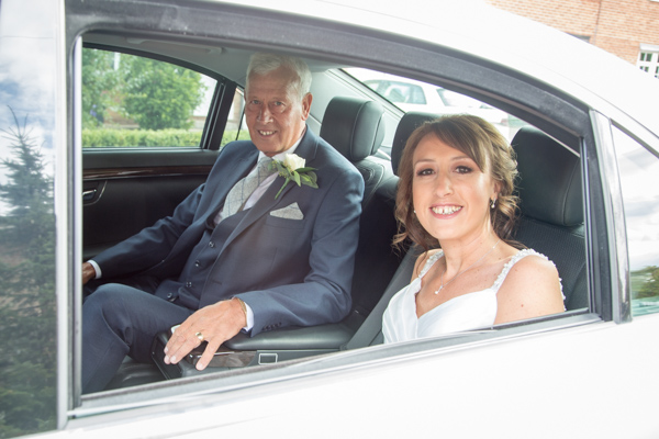 Bride and Father of the bride in the wedding car