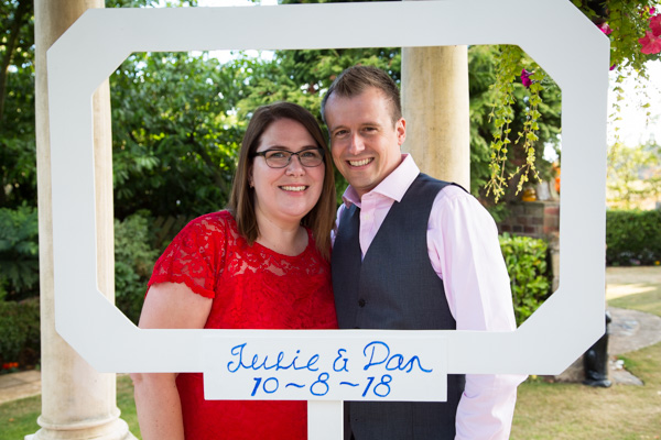 Guests in DIY photo booth at Rogerthorpe Manor Wedding