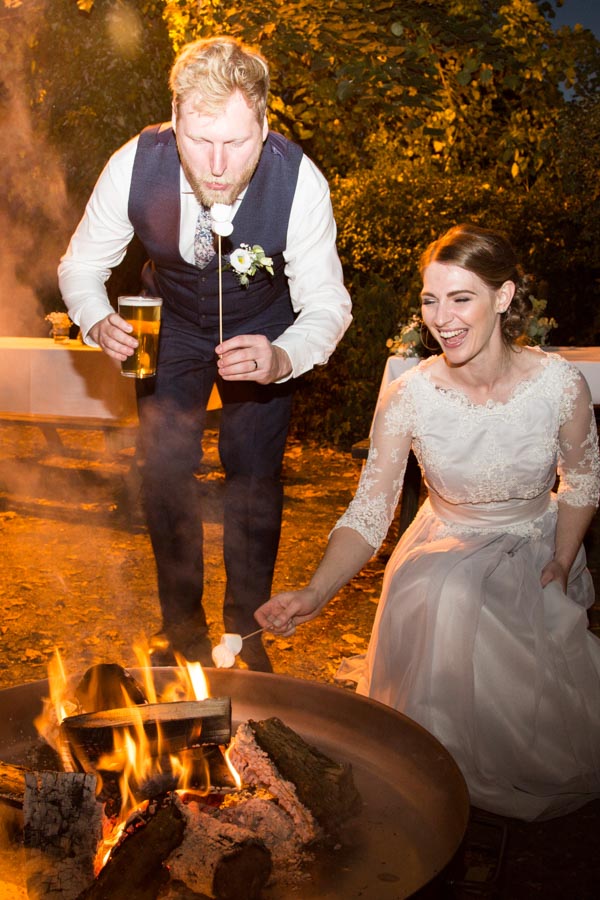 Bride and Groom toasting marshmallows at Rockingham Arms Wentworth Wedding