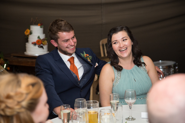 Guests laughing at Horsleygate Hall wedding