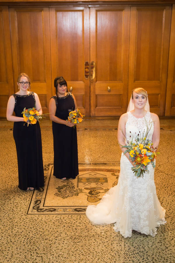 Bride and bridesmaids at the bottom of the stairs at Cutlers' Hall Sheffield