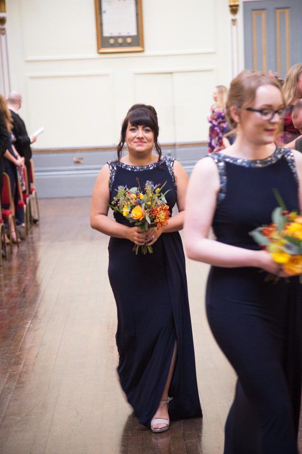 Bridesmaids walking down the aisle at Cutlers' Hall Sheffield