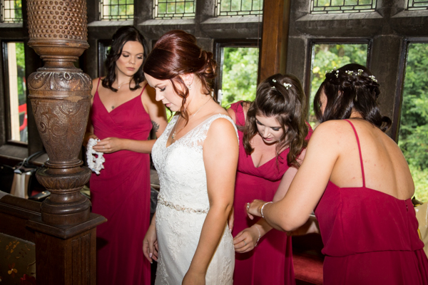 bridal party helping the bride at Whitley Hall Hotel Wedding