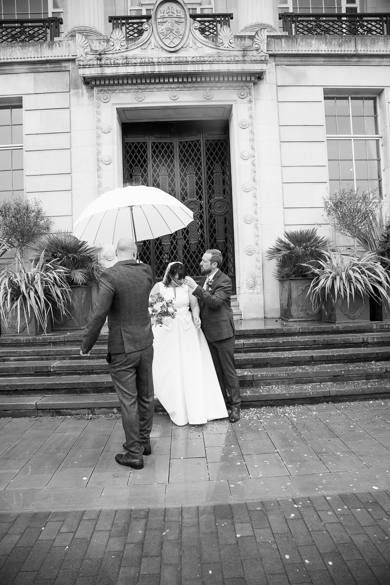 Groom pulls confetti out of brides hair at Barnsley Town Hall Wedding