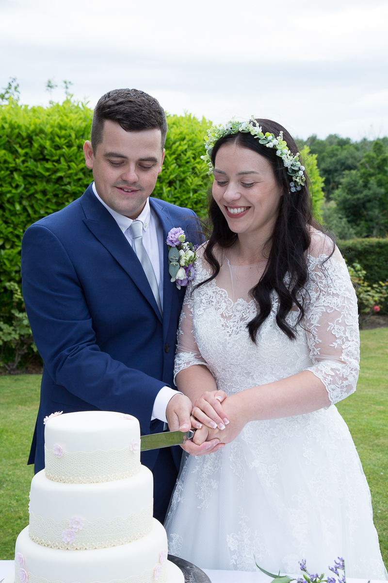 Bride and groom cut the cake Waterton Park Hotel wedding