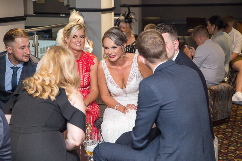Natural wedding photography in the Qube cocktail bar at Burntwood Court Hotel