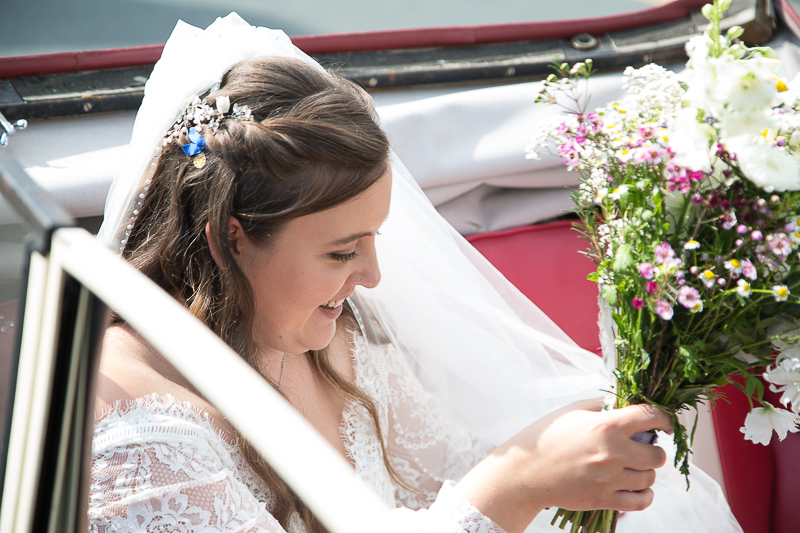 Bride getting in the wedding car in Barnsley