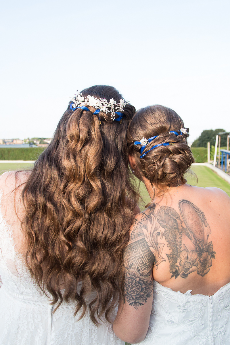 The brides hair with blue ribbons and delicate flowers at Shaw Lane Sports Club Wedding Barnsley