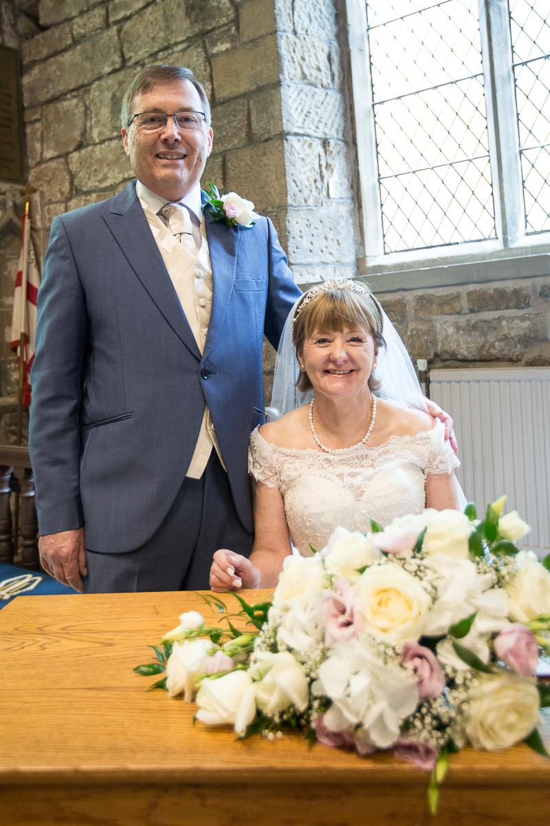 Signing the marriage document at All Saints Church in Darfield