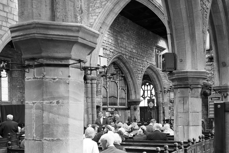 The congregation of a wedding at All Saints Church Darfield