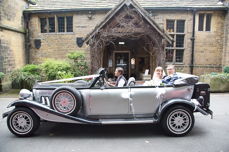 THe bride and groom in the wedding car at Whitley Hall Hotel Sheffield