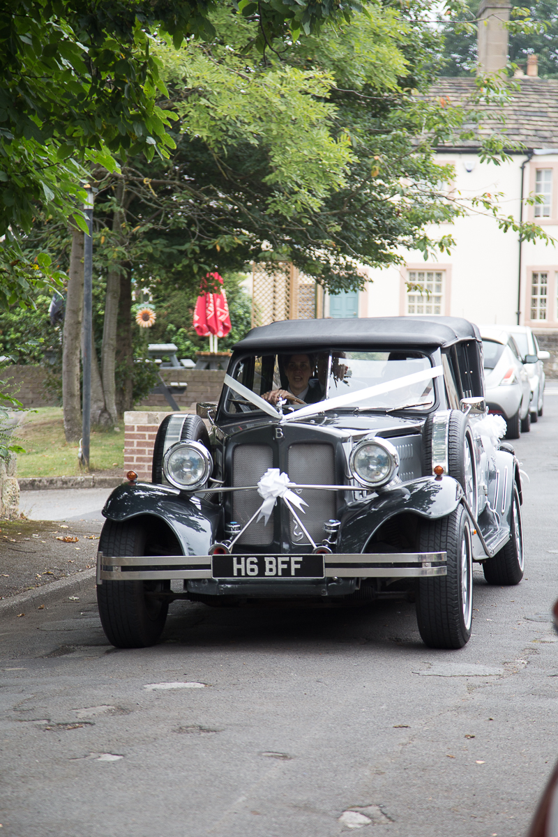 The wedding car arriving at All Saints Church Darfield