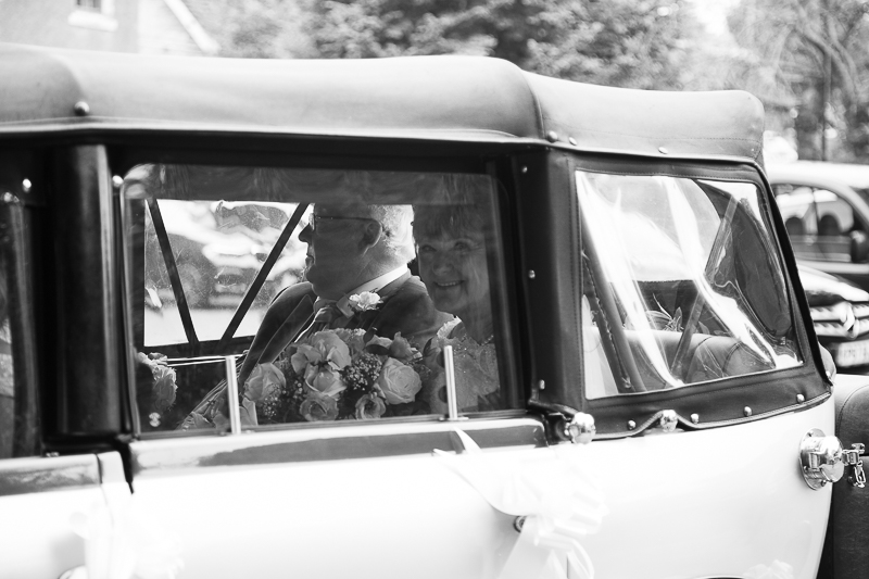 The bride looking out of the wedding car at All Saints Church Darfield
