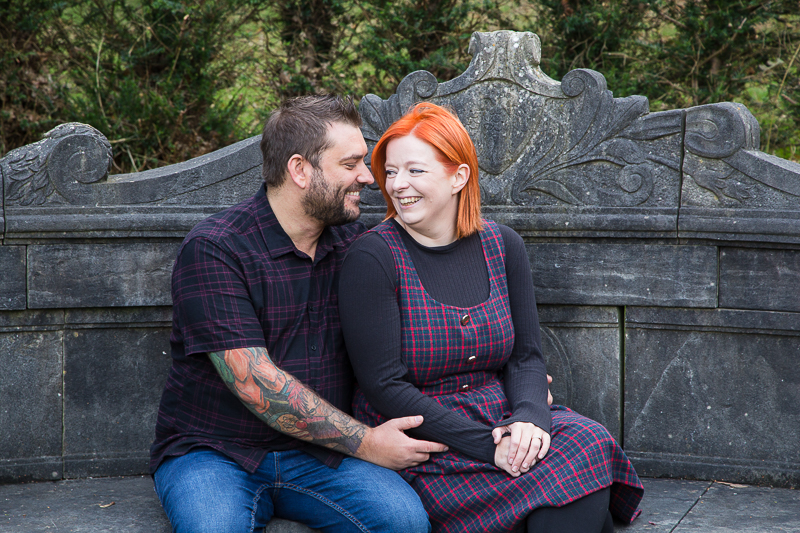 Couple sitting on stone bench at Rossington Hall on their prewedding session with Charlotte Elizabeth Photography