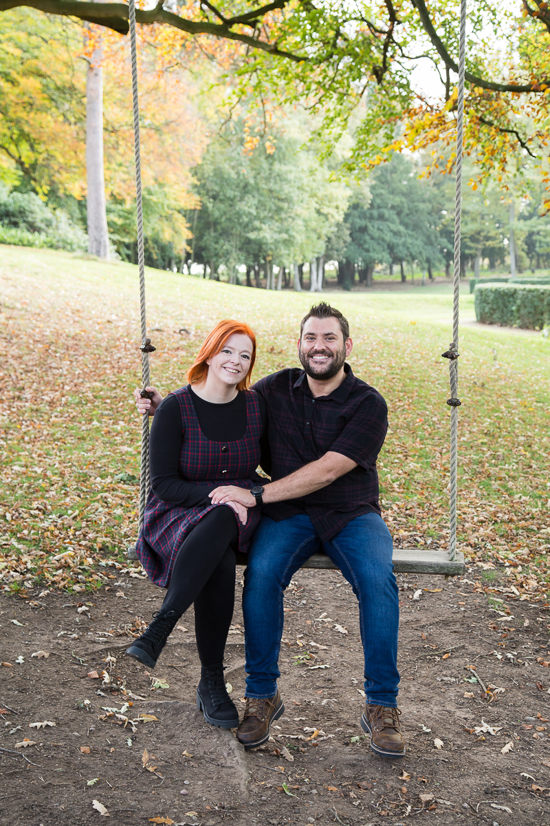 Couple on the swing at Rossington Hall Doncaster South Yorkshire