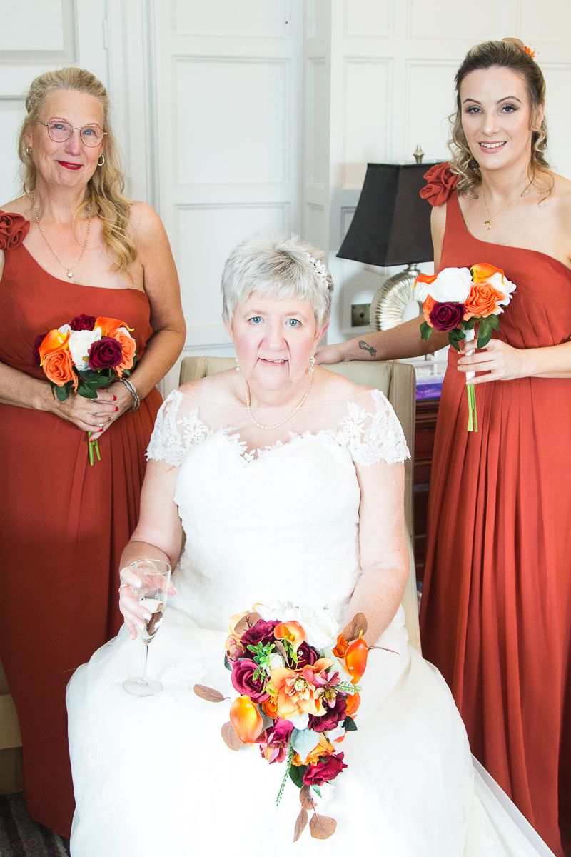 Bride and her two adult bridesmaids before they leave for the wedding ceremony at Wortley Hall Hotel Sheffield