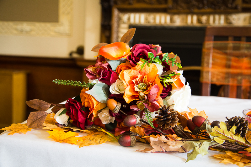 Orange, green and red wedding bouquet at Wortley Hall hotel