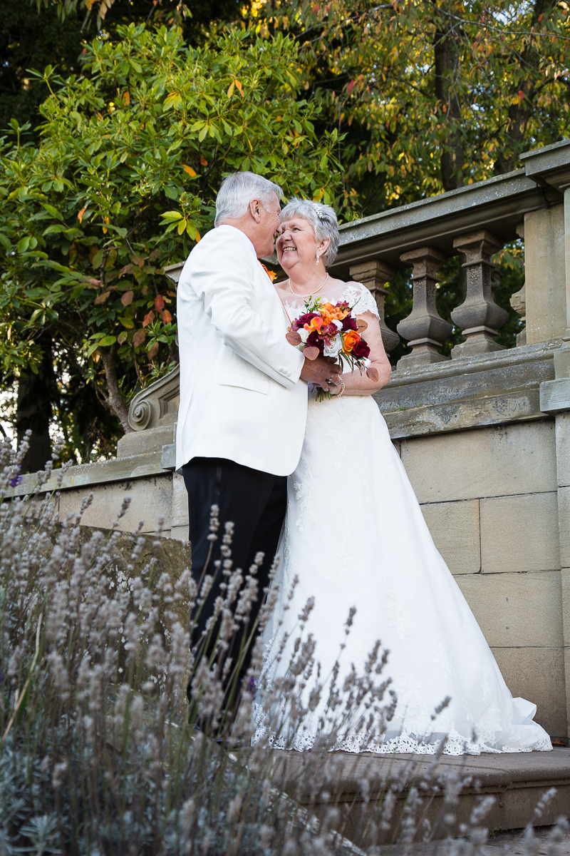 October wedding at Wortley Hall hotel on the stone steps in the grounds