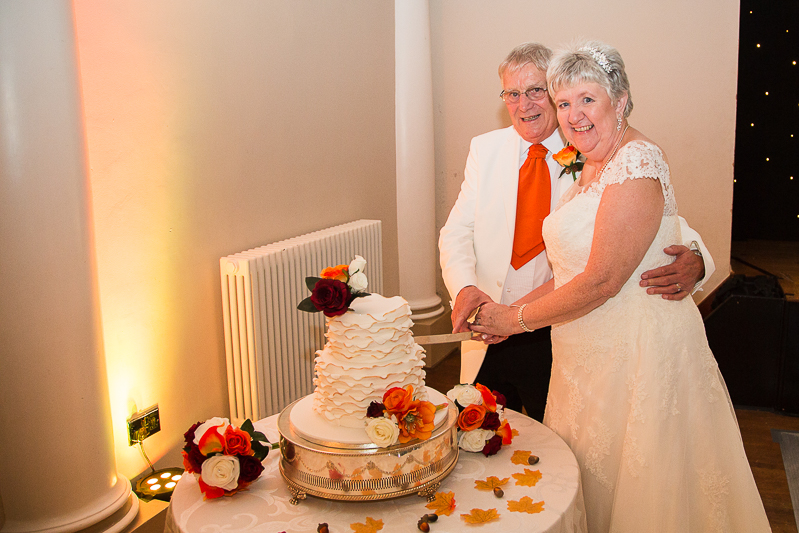 Bride and groom cut the cake at Wortley Hall Hotel Sheffield