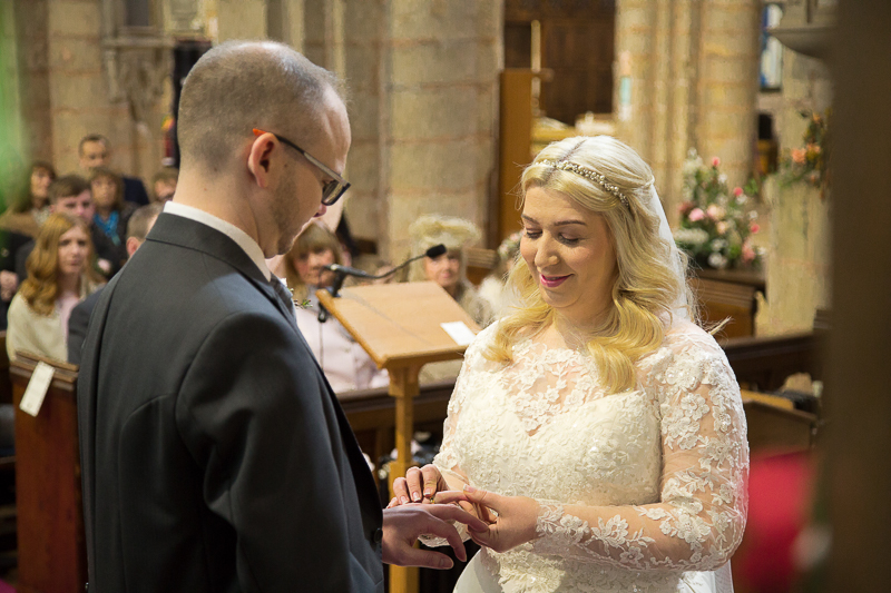Bride and groom exchange wedding rings at St Mary & St Martin's Church Blyth