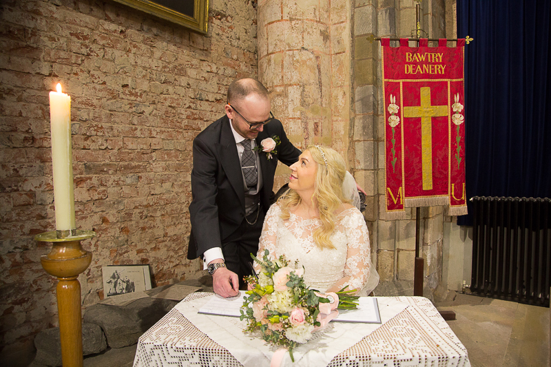 Signing the marriage document at St Mary & St Martin's Church Blyth