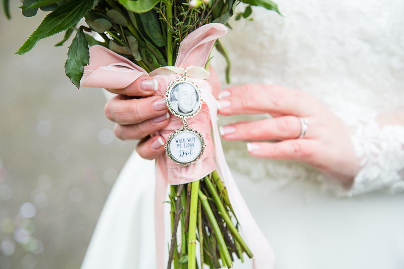 Bridal bouquet detail with a memory photograph