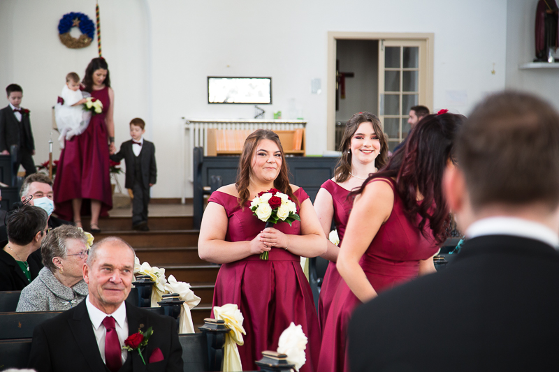 Bridesmaids walking down the aisle in the white church doncaster
