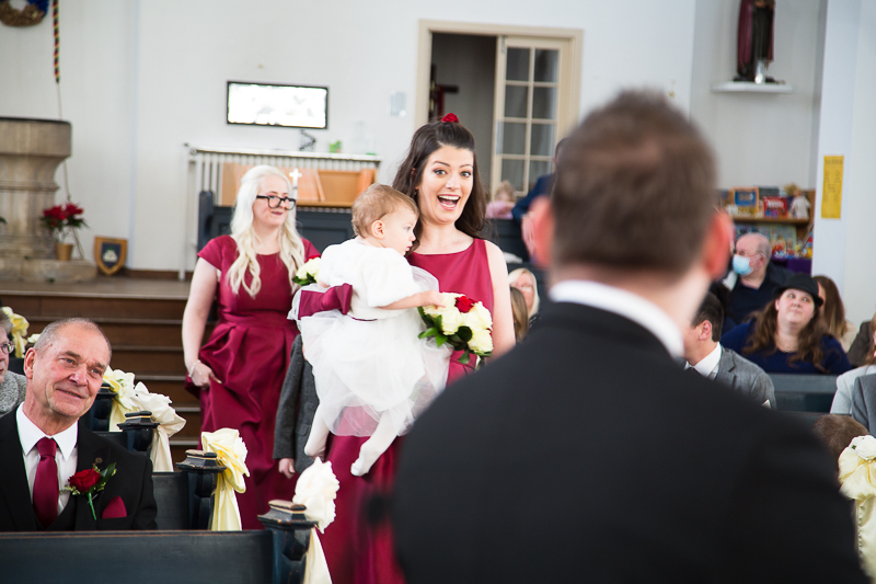 Bridla party walking down the aisle in the white church doncaster