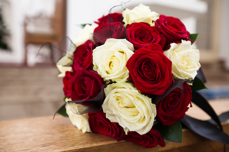 The bridal bouquet with red and white roses