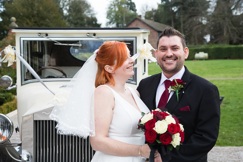 Couple with their wedding car at Rossington Hall Doncaster