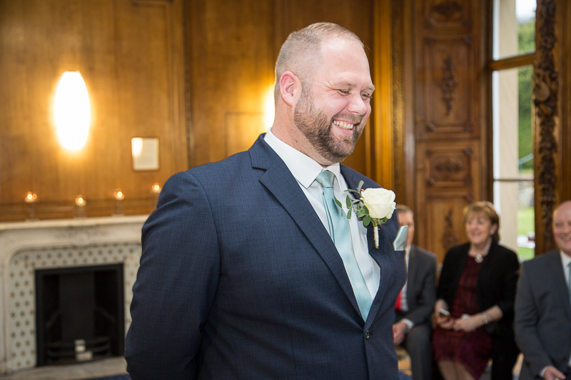 Groom laughing at an intimate January wedding at Wortley Hall Sheffield