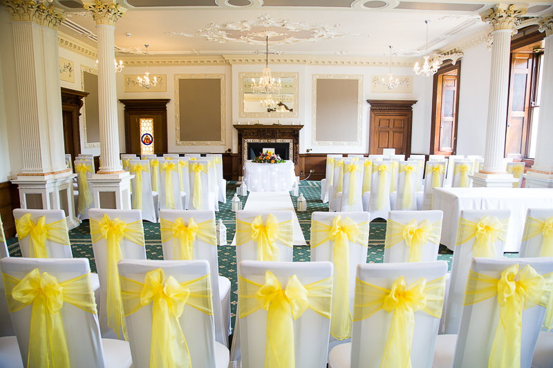 Wedding ceremony room at Wortley Hall decorated in bright yellow