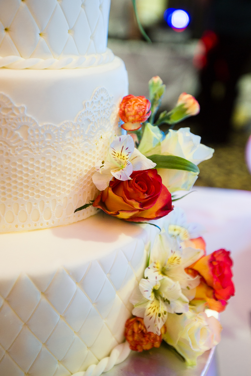 Orange and white theme wedding cake by Charlotte Elizabeth Photography