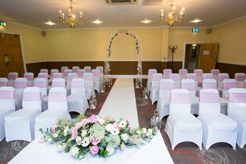 Holiday Inn Barnsley wedding ceremony room decorated in pink and white theme