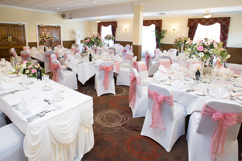 The wedding breakfast room decorated in pink and white theme at Holiday Inn Barnsley