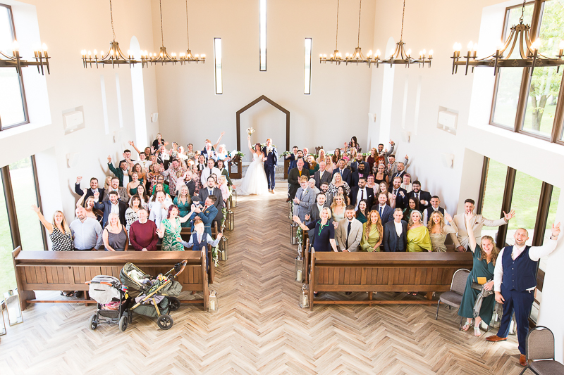 Wedding guests in Burntwood Court Hotel Chapel