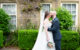 Bride and groom photographs in the grounds at Mosborough Hall Hotel Summer wedding