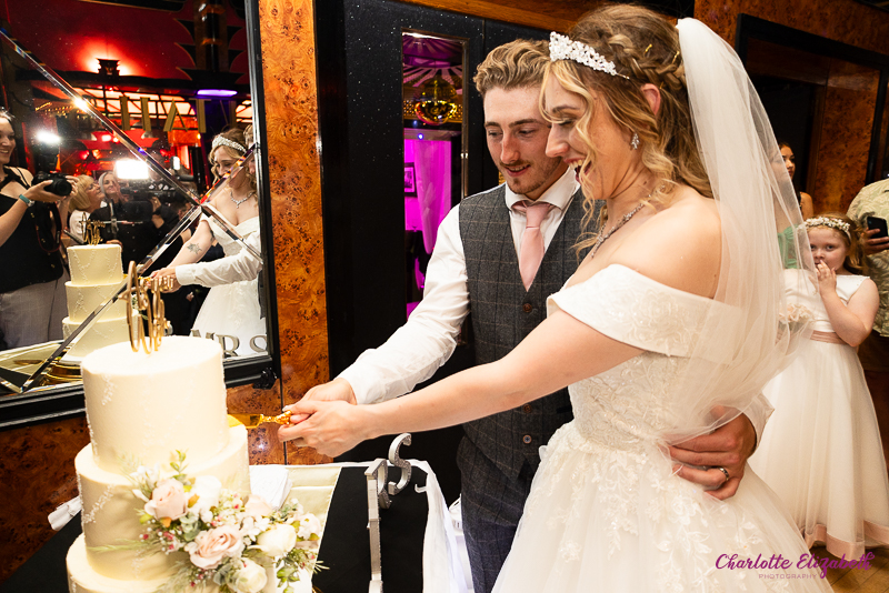 The cake cutting at The Earl of Doncaster wedding photographer